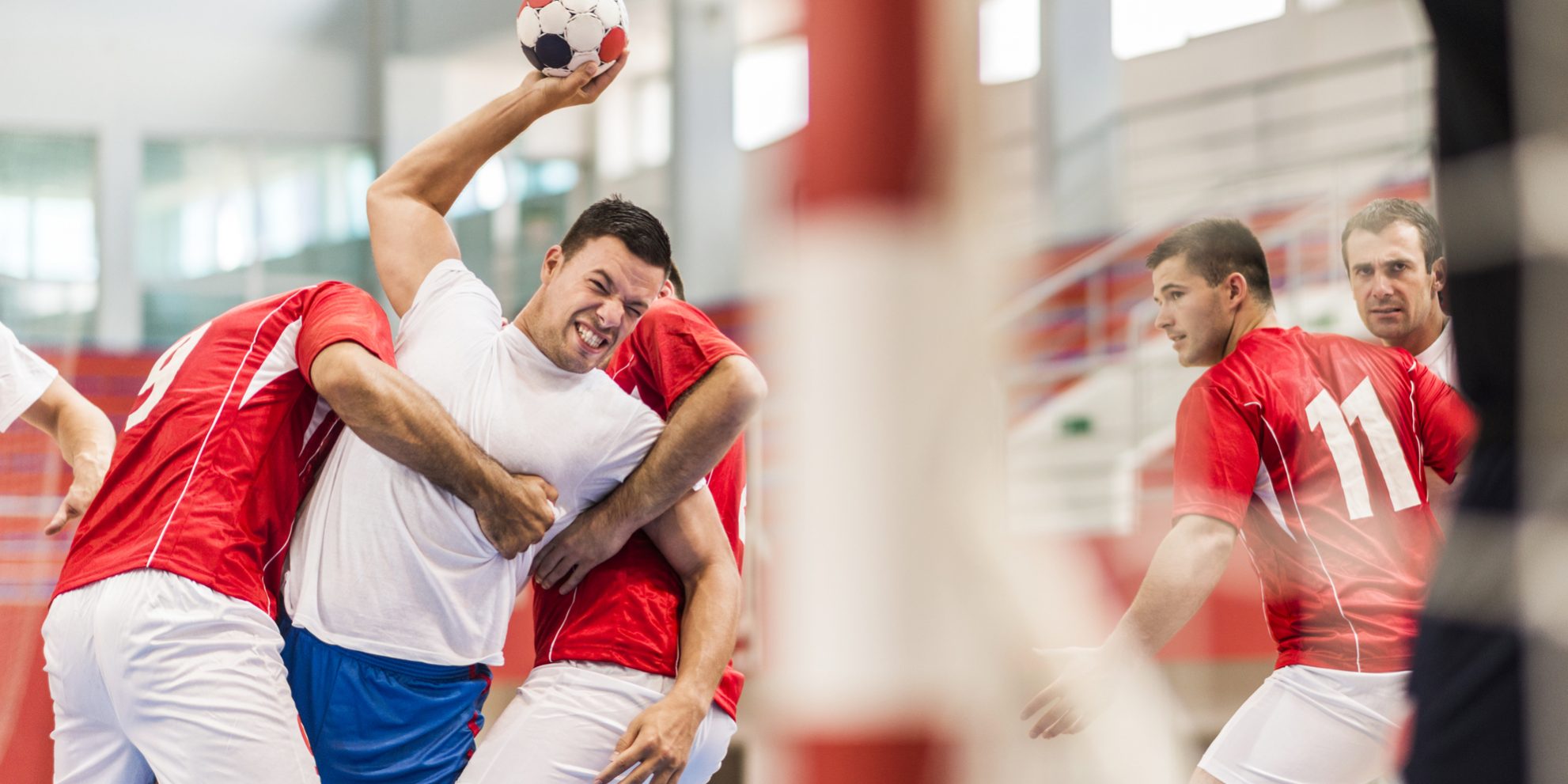 Group of handball players in action.