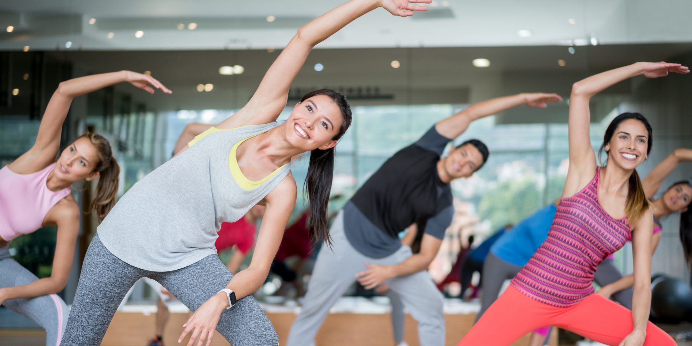 Happy people in an aerobics class at the gym